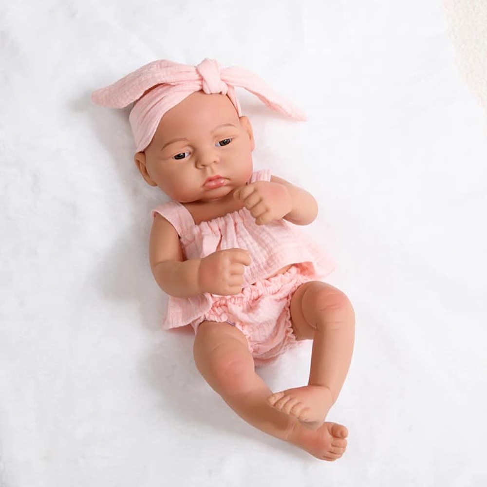 Muñeca de silicona recién nacida para niños con vestido rosa y diadema