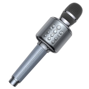 Un micrófono de karaoke gris para niños. Tiene mandos de ajuste en el mango. El mango está hecho de tela cosida.